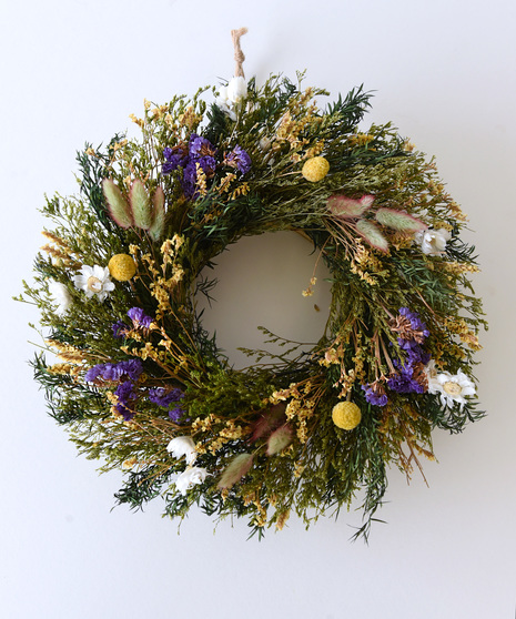 Stunningly beautiful, this dried flowering hanging wreath will never need a drop of water or pruning. This preserved product is made from real plants and will last for years.