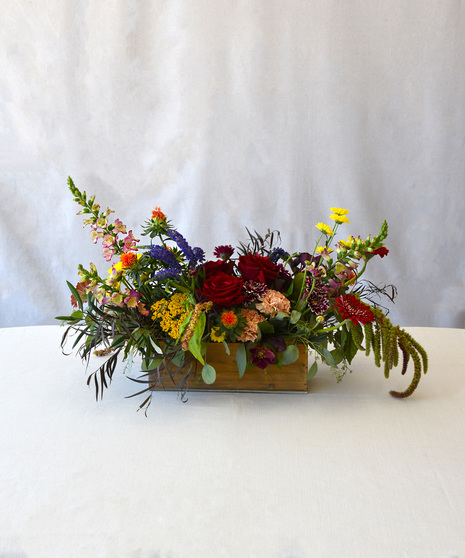 Celebrate Autumn with rich earthy shades of orchids, hydrangea, chrysanthemums, carnations with seasonal foliage presented in a wooden box. 