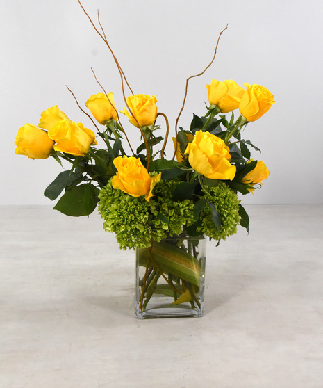 Modern Love is a medley of 12 premium roses with hydrangea and seasonal foliage, designed in a contemporary leaf-lined rectangular glass vase.  