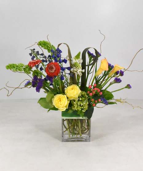 Treat someone to a cheerful palette of floral bliss with a splash of summer color. 