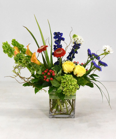 Treat someone to a cheerful palette of floral bliss with a splash of summer color. 